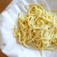 My spaetzle press makes long, thin noodles, but you could make the thumbnail-sized dumpling variety using a colander. (Photo: Kate Bernot)